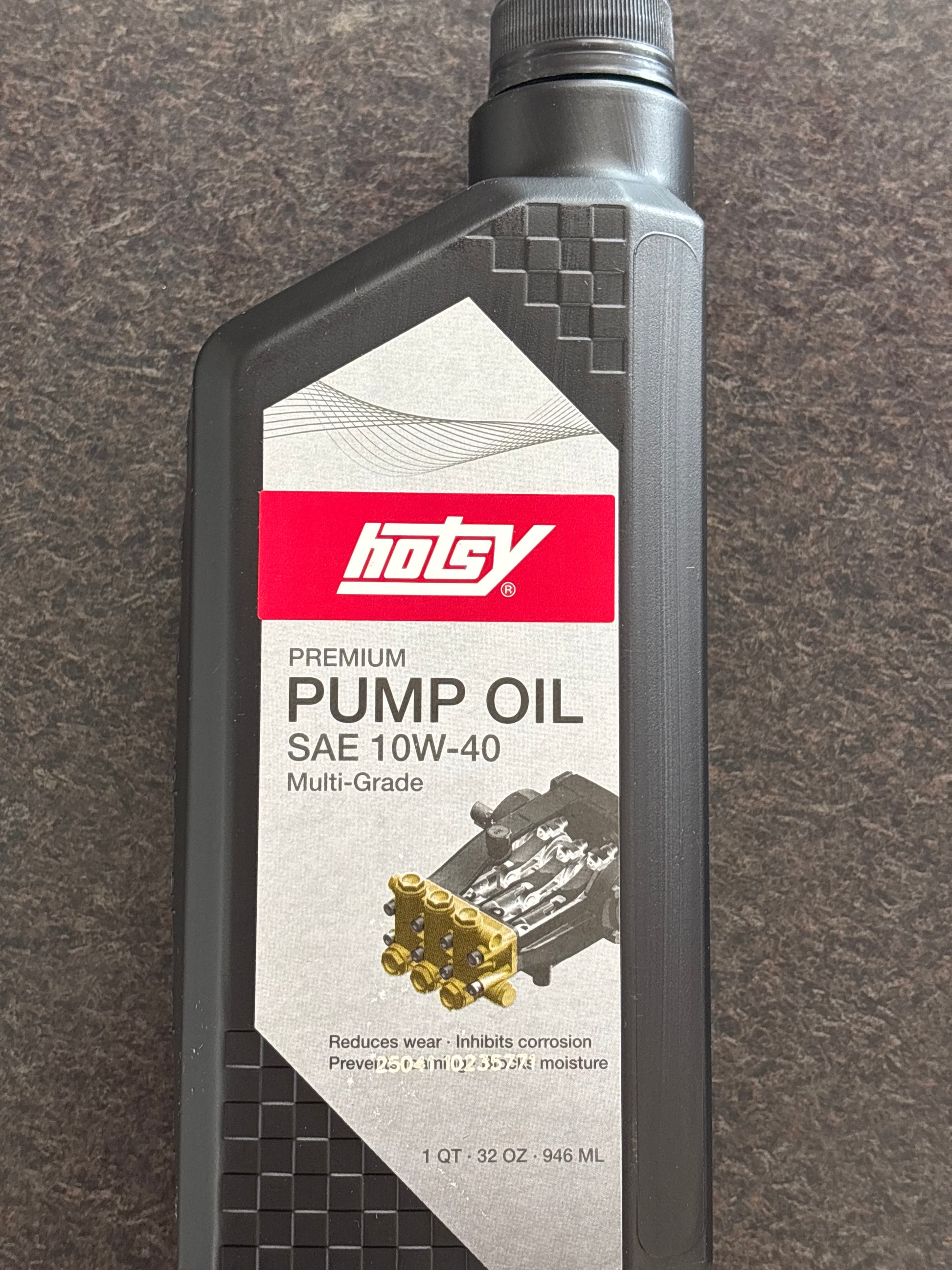 Motor oil bottle with a visible brand logo on a gray background - hotsy